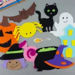 Felt Halloween characters on gray desk