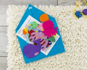 ocean felt set stacked on open envelope with printed insert