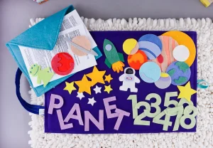 Felt board space set on dark blue play mat